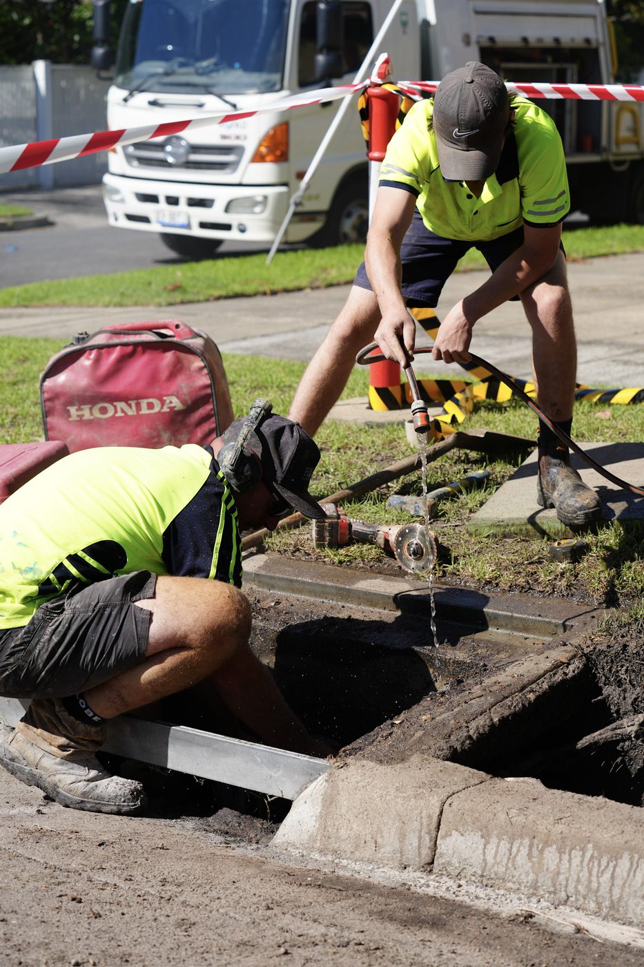 Hoad Drainage crew member working at a drainage access point.